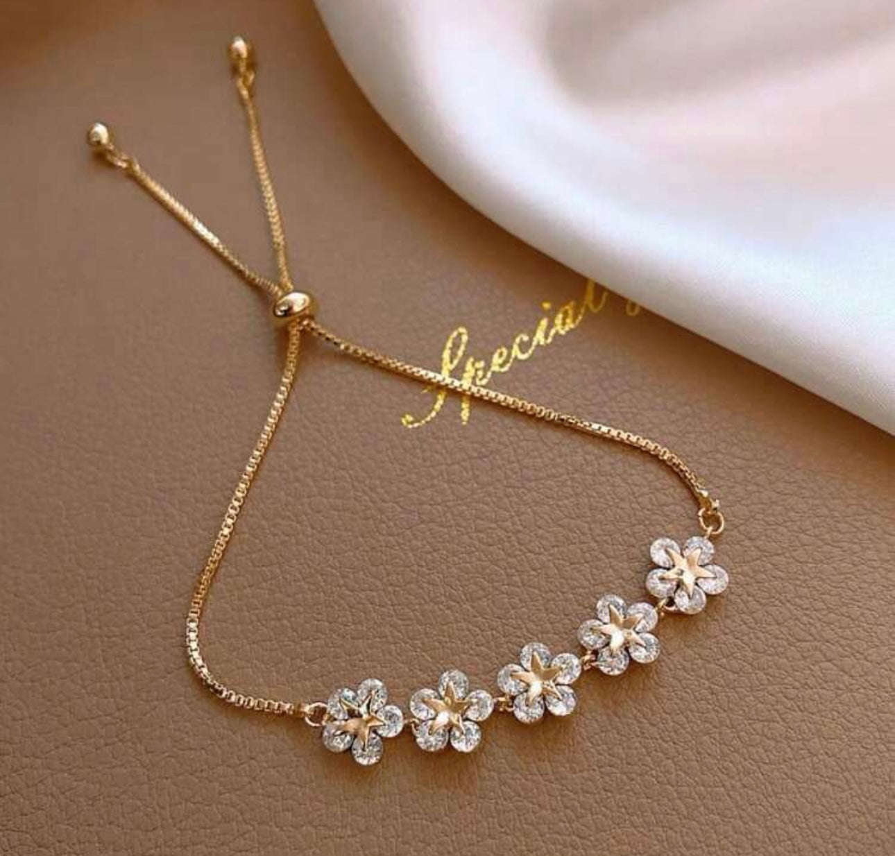 Gold flower & star bracelet
